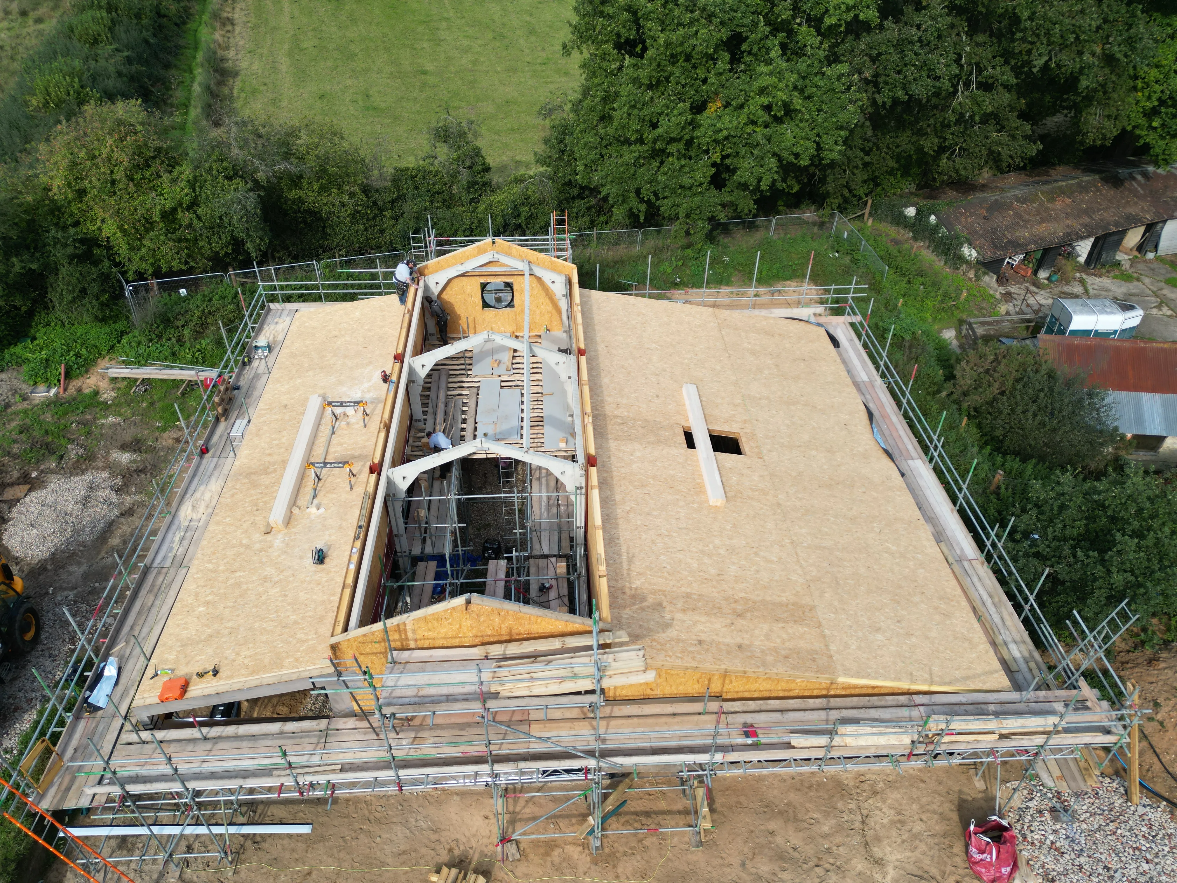 a building under construction with a crane on top of it
